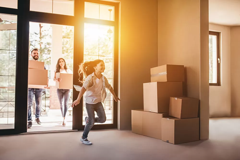 happy family moving into a home