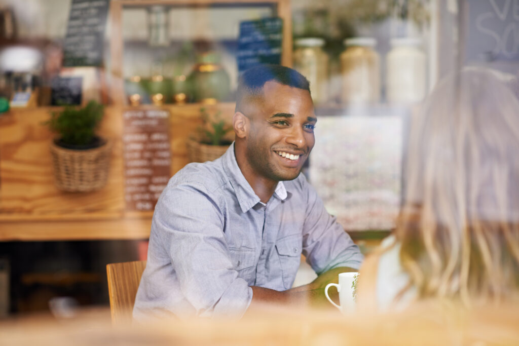 Two friends catching up in a coffee shop