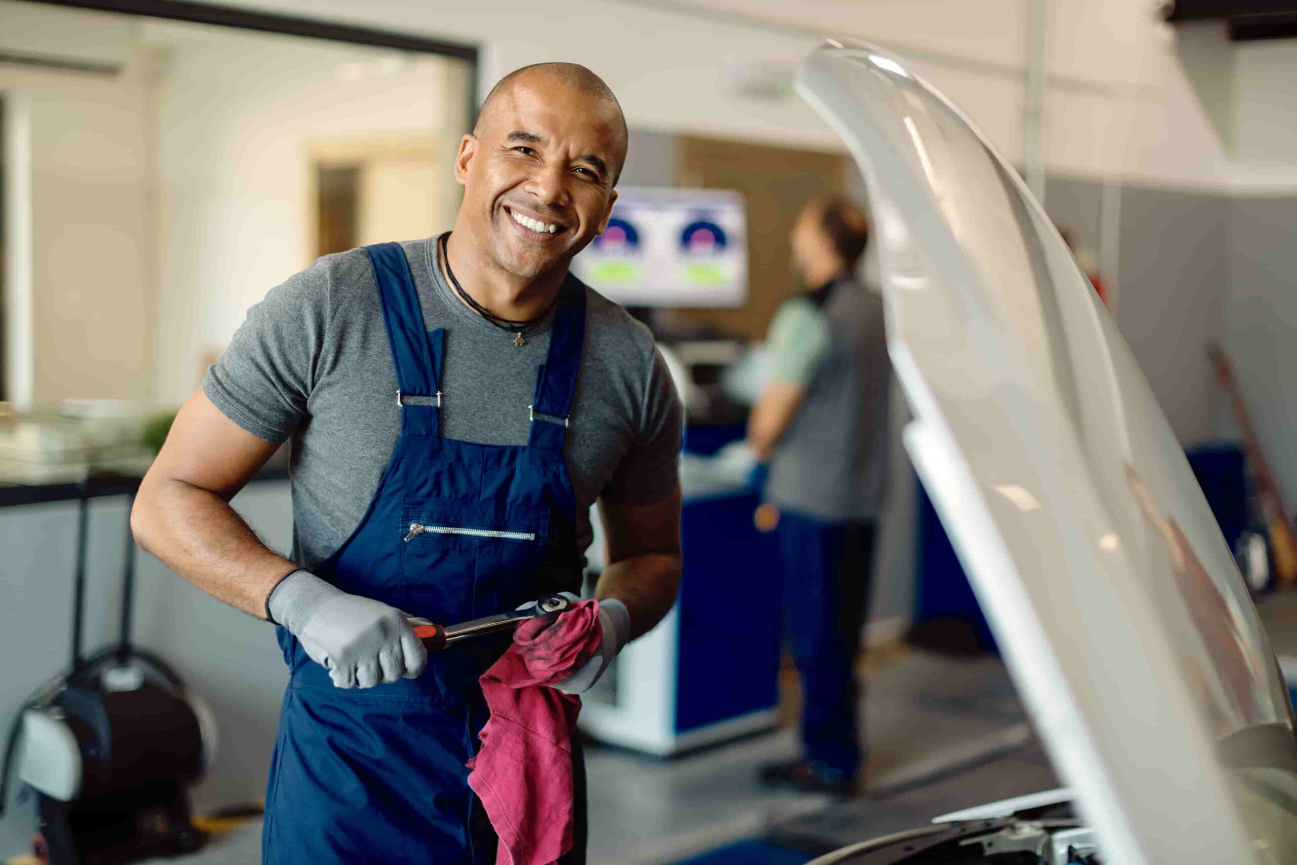 mechanic working on a car in an automotive shop